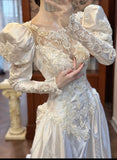 Niulatu White Scoop Neck Satin Long Sleeve Beaded Lace Applique Open Back Train Vintage Wedding Dress HZ1103